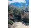 Exterior of the complex with stairs to the second level and mature landscaping at 13781 E Lehigh Ave # E, Aurora, CO 80014