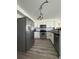 Modern kitchen with stainless steel appliances and white cabinetry, offering a clean and functional space at 13781 E Lehigh Ave # E, Aurora, CO 80014