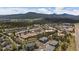 Expansive aerial view of multi-Gathering homes nestled near the mountains and city at 31191 Black Eagle Dr # 304, Evergreen, CO 80439