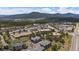 Expansive aerial view of multi-Gathering homes nestled near the mountains and city at 31191 Black Eagle Dr # 304, Evergreen, CO 80439