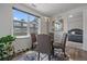 Cozy dining area with modern lighting fixture, seating four and view of outdoors at 31191 Black Eagle Dr # 304, Evergreen, CO 80439