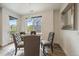 Bright dining area with view of the outdoors, stylish chairs, and modern lighting at 31191 Black Eagle Dr # 304, Evergreen, CO 80439