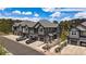 Modern gray townhome features private garages, balconies, and manicured landscaping at 31191 Black Eagle Dr # 304, Evergreen, CO 80439