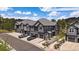 Modern gray townhome features private garages, balconies, and manicured landscaping at 31191 Black Eagle Dr # 304, Evergreen, CO 80439
