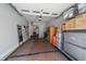 Organized two-car garage with ample storage space for vehicles and household items at 31191 Black Eagle Dr # 304, Evergreen, CO 80439