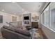 Cozy living room with a stylish stone fireplace, hardwood floors, and a comfortable gray sofa at 31191 Black Eagle Dr # 304, Evergreen, CO 80439