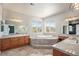 Bright bathroom featuring a corner bathtub and large windows providing natural light and lovely scenic views at 22090 E Arbor Dr, Aurora, CO 80016