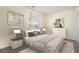 Elegant bedroom with neutral tones, refined decor, plush bedding and stylish bedside tables at 22090 E Arbor Dr, Aurora, CO 80016