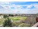 Scenic view of the lush green golf course from this homes upper level deck at 22090 E Arbor Dr, Aurora, CO 80016