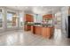 Large kitchen with a central island and stainless steel appliances, offering great natural light at 22090 E Arbor Dr, Aurora, CO 80016