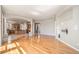Spacious open floor plan with hardwood floors, leading to the kitchen and other areas at 22090 E Arbor Dr, Aurora, CO 80016