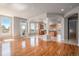 Open floor plan featuring hardwood floors with an archway leading to the kitchen at 22090 E Arbor Dr, Aurora, CO 80016