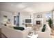 Bright living room with plush sofas, modern decor, and a fireplace with a decorative mantel at 22090 E Arbor Dr, Aurora, CO 80016