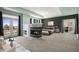 Bright main bedroom with fireplace, balcony access, and neutral decor at 22090 E Arbor Dr, Aurora, CO 80016