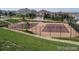 Community tennis courts featuring mature trees in the background at 22090 E Arbor Dr, Aurora, CO 80016