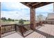 Spacious wooden deck with railing and stunning views of the surrounding neighborhood and landscape at 22090 E Arbor Dr, Aurora, CO 80016