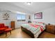 Well-lit bedroom featuring a comfortable bed, a bright window with city views and stylish furnishings at 800 N Washington St # 710, Denver, CO 80203
