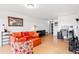 Inviting living room features a sofa, chair, ottomans, and cork floors with a cozy ambiance at 800 N Washington St # 710, Denver, CO 80203