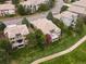 An aerial view of beautiful residences surrounded by lush greenery showcases the property's prime location and landscaping at 16631 Red Cliff Cir, Morrison, CO 80465