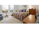 Bright bedroom featuring a comfortable bed, natural light, and a calming ambiance at 16631 Red Cliff Cir, Morrison, CO 80465