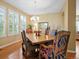 Elegant dining room featuring a wooden table, upholstered chairs, and a chandelier at 16631 Red Cliff Cir, Morrison, CO 80465