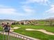 Picturesque view of the golf course and mountains from the patio, with beautiful flower, perfect for nature lovers and relaxation at 16631 Red Cliff Cir, Morrison, CO 80465