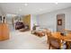 Spacious living room featuring a piano, dining area, and comfortable seating arrangement at 16631 Red Cliff Cir, Morrison, CO 80465