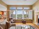 Sunlit living room with large windows offers relaxing views of the outdoors at 16631 Red Cliff Cir, Morrison, CO 80465