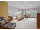 Bright living room with large windows, comfortable seating, and access to the outdoors at 16631 Red Cliff Cir, Morrison, CO 80465