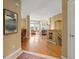 Spacious living room with hardwood floors, fireplace, and large windows offering scenic views at 16631 Red Cliff Cir, Morrison, CO 80465