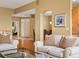 Open concept living room features hardwood floors and view to front entry at 16631 Red Cliff Cir, Morrison, CO 80465