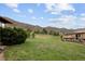 Expansive grassy backyard with mountain views, surrounded by luxury homes in a serene setting at 11227 Explorers Run, Littleton, CO 80125