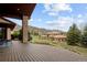 Large backyard deck with mountain views, perfect for outdoor entertaining at 11227 Explorers Run, Littleton, CO 80125