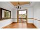 Bright dining room with hardwood floors, large window, and designer ceiling at 11227 Explorers Run, Littleton, CO 80125