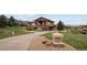 Beautiful two-story home featuring a landscaped front yard and an inviting stone mailbox at 11227 at 11227 Explorers Run, Littleton, CO 80125