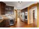 Modern kitchen with stainless steel appliances, wine rack, and stone accents at 11227 Explorers Run, Littleton, CO 80125