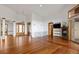 Spacious living room featuring hardwood floors, a fireplace, and an abundance of natural light at 11227 Explorers Run, Littleton, CO 80125