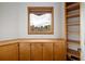 Home office featuring built-in cabinets and a window with a view at 11227 Explorers Run, Littleton, CO 80125