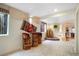 Finished basement with decorative rug, seating, and window at 21863 E Oxford Pl, Aurora, CO 80018