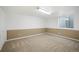 Spacious basement with carpet and a small window, ready for your personal touch at 21863 E Oxford Pl, Aurora, CO 80018