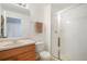 Bathroom with walk-in shower and single vanity at 21863 E Oxford Pl, Aurora, CO 80018