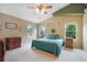Bright bedroom featuring a ceiling fan, southwest decor, and two windows for natural light at 21863 E Oxford Pl, Aurora, CO 80018