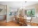 Dining area with a large table, chandelier, and views into the living room at 21863 E Oxford Pl, Aurora, CO 80018