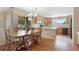 Eat-in kitchen with wood cabinets, a large dining table, and a large window for natural light at 21863 E Oxford Pl, Aurora, CO 80018