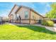 Home exterior with lush lawn and drought tolerant landscaping at 21863 E Oxford Pl, Aurora, CO 80018