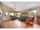 Bright living room featuring hardwood floors, vaulted ceiling, and access to the outdoor space at 21863 E Oxford Pl, Aurora, CO 80018