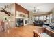 Spacious living room featuring vaulted ceilings, a fireplace, and large windows for natural light at 21863 E Oxford Pl, Aurora, CO 80018