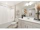 Clean bathroom with tub, single vanity, and modern fixtures at 9876 Ceylon Ct, Commerce City, CO 80022