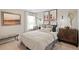 Bright bedroom with a comfortable bed and stylish decor at 9876 Ceylon Ct, Commerce City, CO 80022