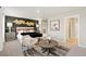 Main bedroom with dark accent wall, sitting area, and ensuite bath at 9876 Ceylon Ct, Commerce City, CO 80022